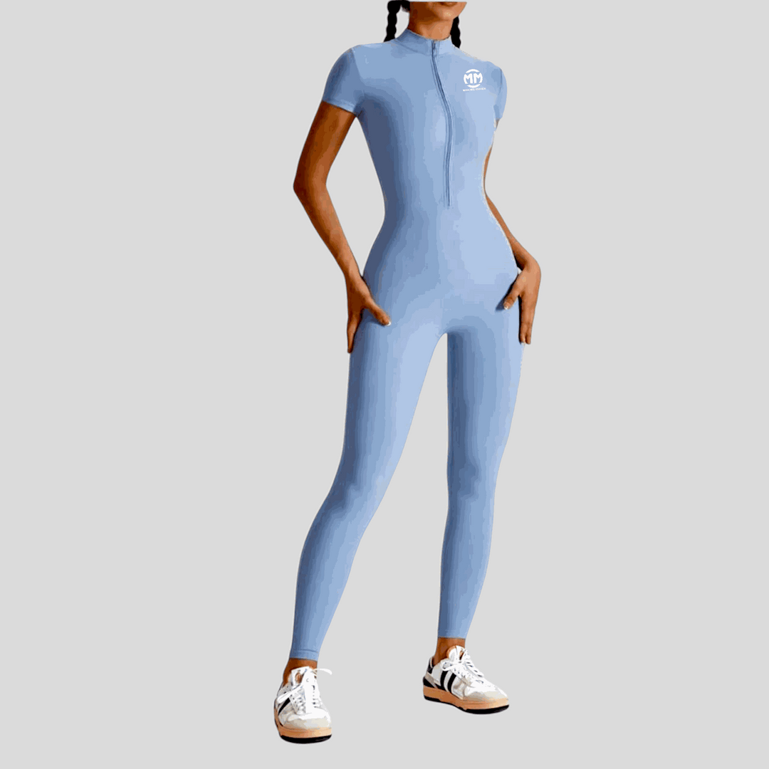 Main Character 2.0 Short Sleeve Jumpsuit with mock neck zipper, tight fit, above-the-ankle length, in blue.