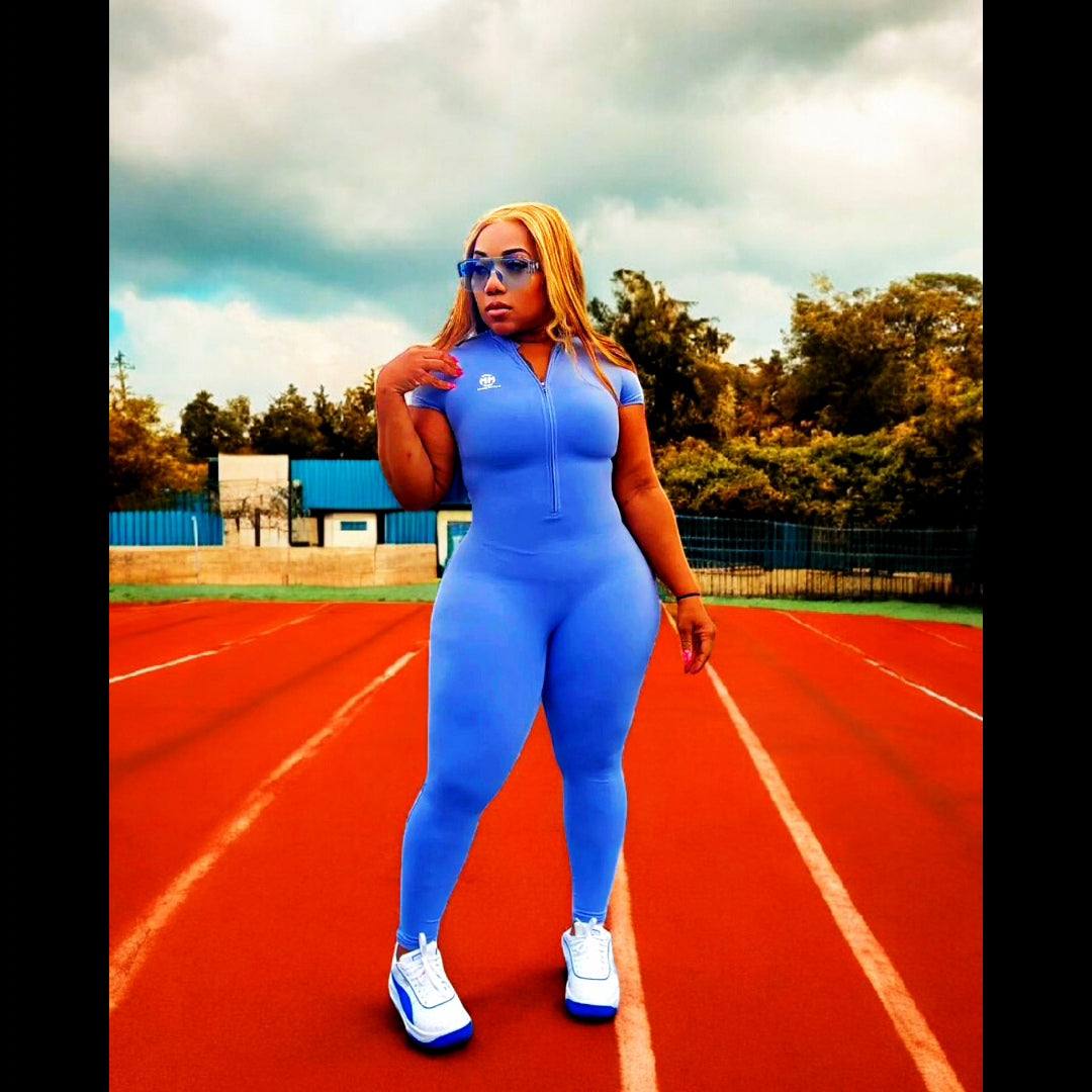 Main Character 2.0 Jumpsuit in athletic fit on a running track.