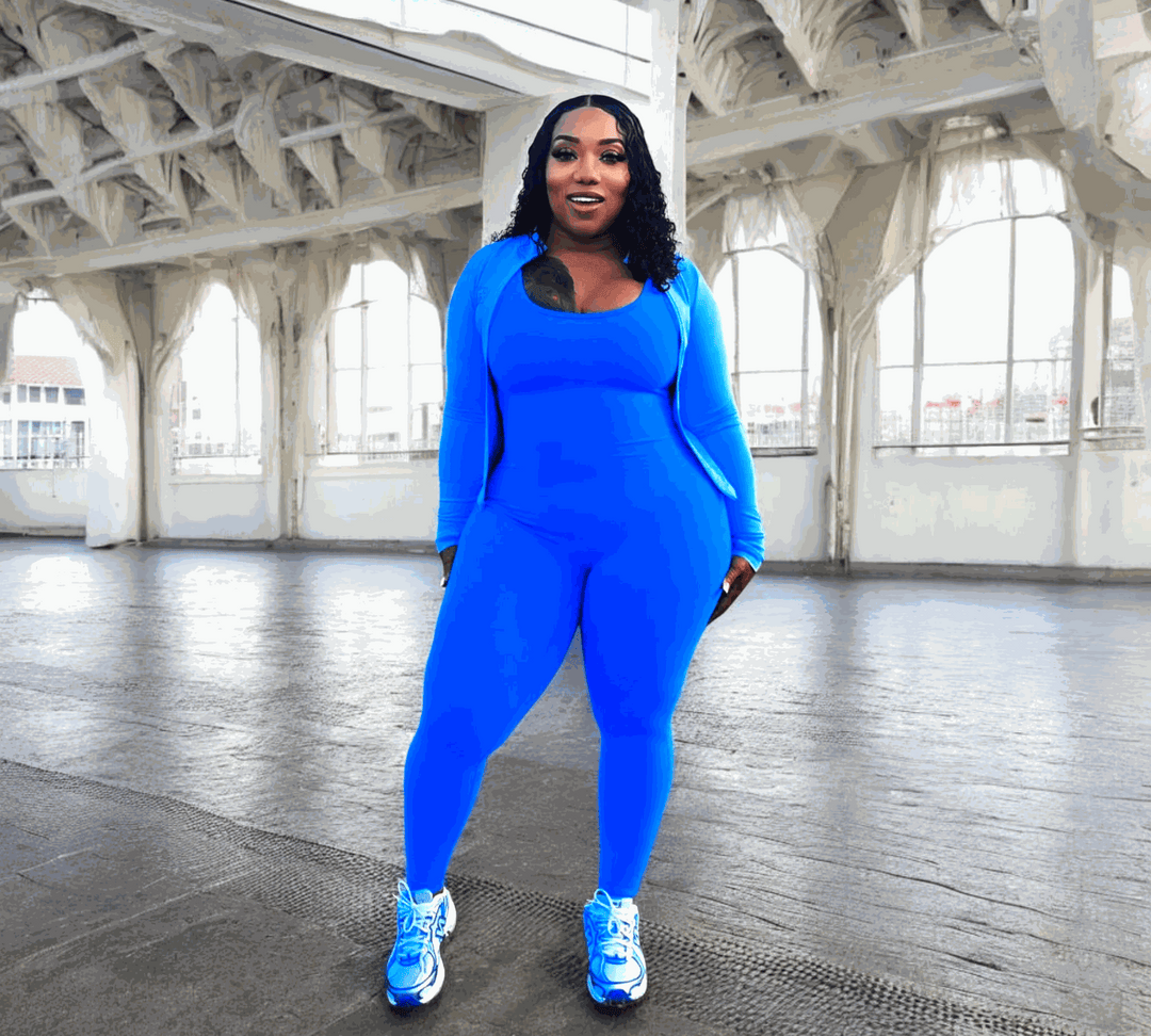 POWER SLEEVELESS JUMPSUIT in bright blue, featuring moisture-wicking fabric, detachable padding, and a V-shaped scrunch back design, ideal for workouts.