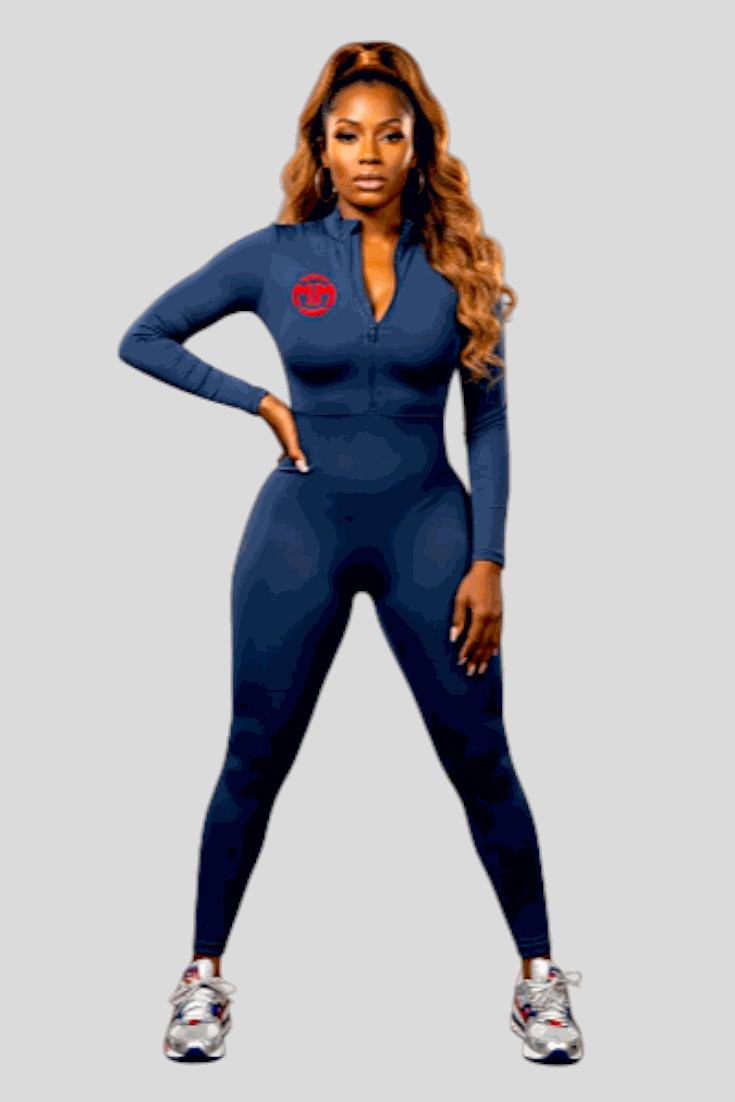 Woman wearing navy Iconic Jumpsuit with zipper and long sleeves for exercise and mobility