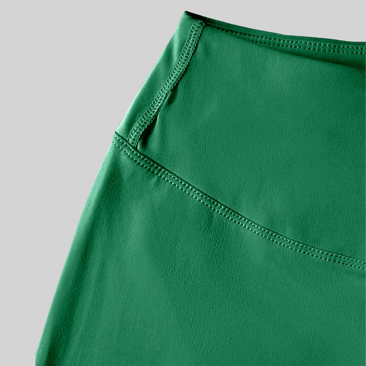 Close-up of the Chill & Conquer Lounge Set showcasing high-stretch, breathable fabric in vibrant green.